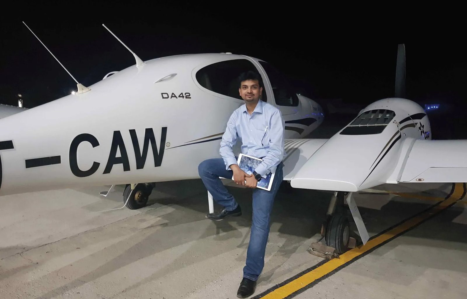 Nikhil Sharma, founder of Refogo, beside a Diamond DA42 aircraft
